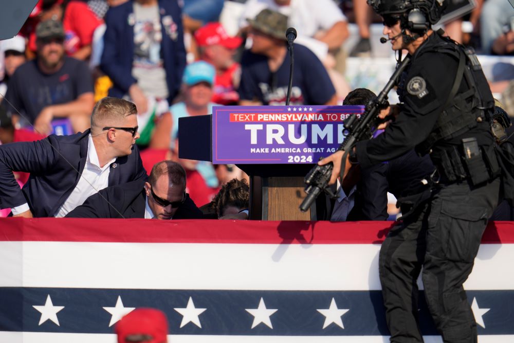 Republican presidential candidate former President Donald Trump is surrounded by U.S. Secret Service after an assassination attempt at a campaign event in Butler, Pennsylvania, on July 13. Republican presidential candidate former President Donald Trump is surrounded by U.S. Secret Service after an assassination attempt at a campaign event in Butler, Pennsylvania, on July 13.
